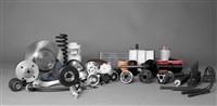 Photo of a collection of auto parts. 3 Auto Parts Makers Achieving Double-Digit Growth.