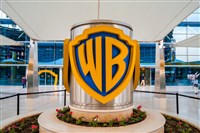 Photo of WB logo on a pillar at company headquarters. Can Warner Bros. Discovery-Disney Bundle Challenge Netflix? 