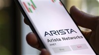 closup photo of hand holding mobile device with Arista Networks name and logo displayed