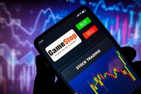 In this photo illustration the stock trading graph of GameStop seen on a smartphone screen