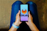 GitLab logo is displayed on a smartphone screen