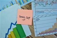 Concept of Small Cap write on sticky notes isolated on Wooden Table.