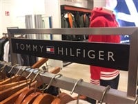 Berlin, Germany - October 11, 2018: Tommy Hilfiger sign. Tommy Hilfiger Corporation is a manufacturer of clothing. It produces and sells sporting men's and women clothing — Stock Editorial Photography