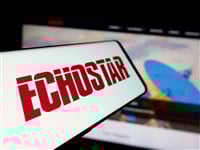 Stuttgart, Germany - 06-07-2025: Smartphone with logo of US telecom company EchoStar Corporation on screen in front of website. Focus on center-left of phone display.