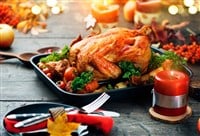 Thanksgiving table with a turkey in the center.