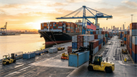 Cargo ship unloading containers at U.S. port with American flag, symbolizing tariff rollback and renewed trade.