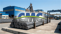 Steel rebar stacks at a Commercial Metals Company facility, highlighting steel rebound and manufacturing strength.