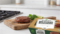 Beyond Meat burger patty and packaging on kitchen counter, highlighting plant-based meat amid weakening demand trend.