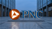 PNC bank logo displayed outside a modern office building, reflecting strong financial performance and growth in regional banking.
