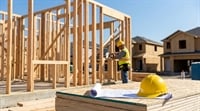 A photorealistic view of a new residential home's wooden framing under construction.