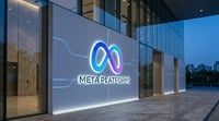 Meta Platforms illuminated logo and wordmark displayed on the exterior wall of a modern office building.
