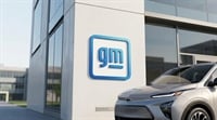General Motors logo on the exterior wall of an imaginative depiction of the company's headquarters, with a Chevrolet electric vehicle in the foreground.