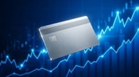 A generic metal credit card overlaid on a blue stock market chart trending upward.