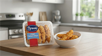 A package of Tyson Foods Crispy Chicken Strips displayed on a kitchen counter beside a bowl of the product.