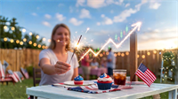 A woman holds a sparkler at a Fourth of July backyard gathering, with a stock chart graphic overlaid.
