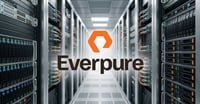 Everpure logo overlaid on a data center corridor lined with server racks.