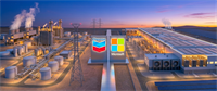 Chevron and Microsoft logos displayed in front of an industrial energy facility and data center at dusk.
