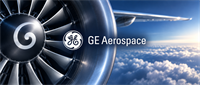 Jet engine turbine with GE Aerospace logo and a plane wing visible above clouds in the sky.