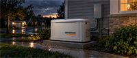 A Generac home standby generator installed outside a residential house at dusk, connected to an electrical panel.