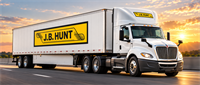 A white J.B. Hunt semi-truck and trailer with the company logo driving on a highway at sunset.
