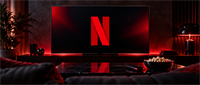 Television displaying the Netflix logo in a dark living room with a coffee table, popcorn bowl, and remote.