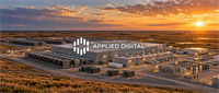 Aerial view of an Applied Digital data center facility with cooling units and buildings at sunset.