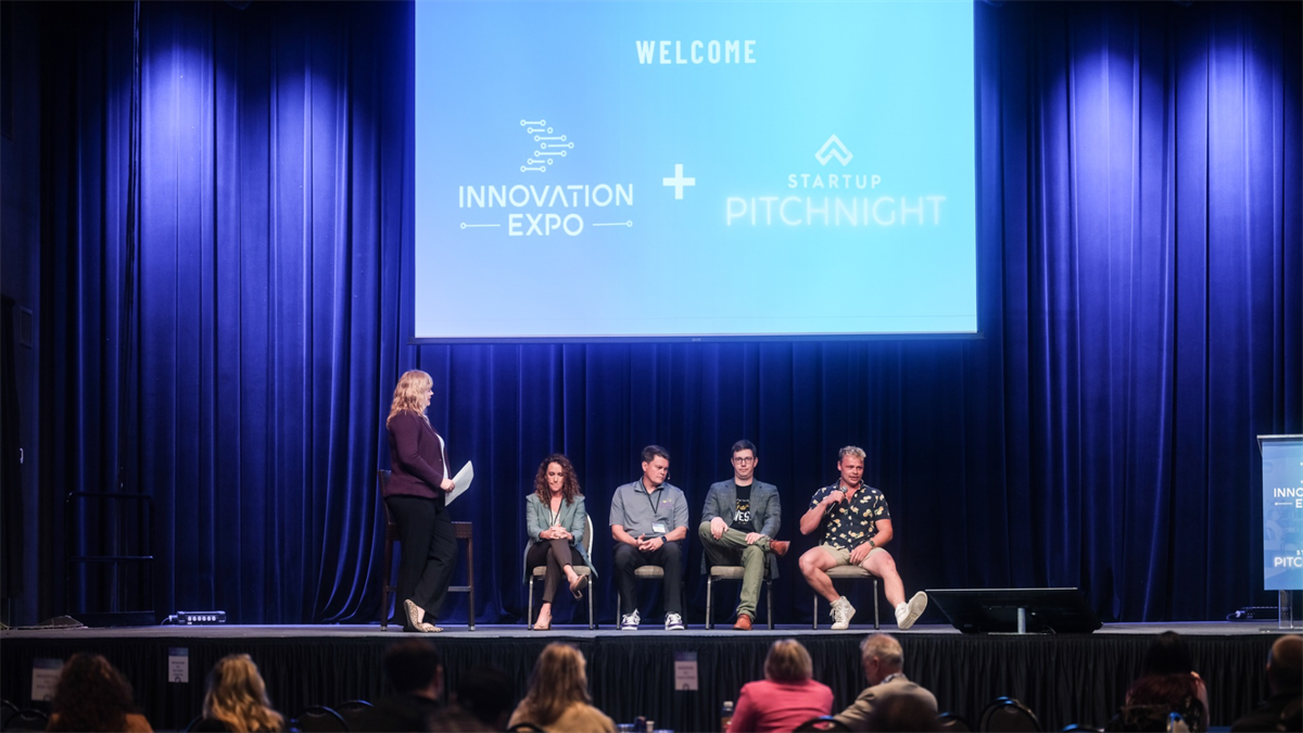 Panel on stage at the Innovation Expo conference.