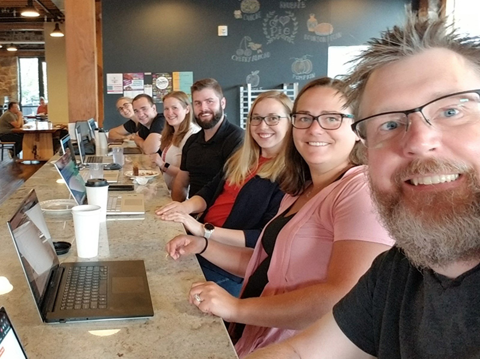 Employees working at the bar at Queen City Bakery