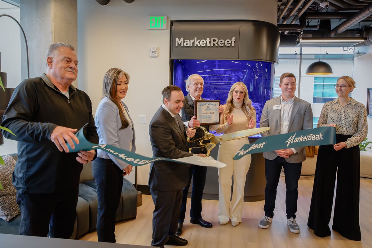 MarketBeat cutting ribbon at open house